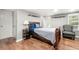 Basement bedroom with a double bed and sitting chair at 6650 Queen Mill Se Rd, Mableton, GA 30126