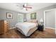 Spacious bedroom with wood flooring and a ceiling fan at 6650 Queen Mill Se Rd, Mableton, GA 30126