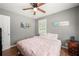 Bedroom with a queen bed, wood floors, and ceiling fan at 6650 Queen Mill Se Rd, Mableton, GA 30126