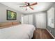 Spacious main bedroom with double doors and ceiling fan at 6650 Queen Mill Se Rd, Mableton, GA 30126