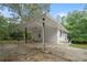 Carport next to the house with a concrete pad at 6650 Queen Mill Se Rd, Mableton, GA 30126
