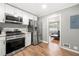 Modern kitchen with stainless steel appliances and light cabinets at 6650 Queen Mill Se Rd, Mableton, GA 30126