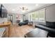 Living room with hardwood floors and comfortable seating at 6650 Queen Mill Se Rd, Mableton, GA 30126