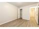 Bedroom with wood-look floors and access to hallway at 417 Tina Hely Ct, Stockbridge, GA 30281