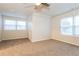 Spacious bedroom with neutral carpeting and ceiling fan at 417 Tina Hely Ct, Stockbridge, GA 30281
