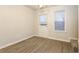 Dining area with wood-look flooring, a door, window, and carpeted stairs at 417 Tina Hely Ct, Stockbridge, GA 30281
