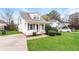 House exterior showcasing a cozy front porch and neatly landscaped yard at 417 Tina Hely Ct, Stockbridge, GA 30281