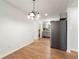 Dining room with hardwood floors and modern chandelier at 2635 Williams Grant Reynolds Dr, Lithonia, GA 30058