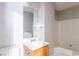 Clean bathroom with a tub, vanity, and mirror at 4480 Joseph Dr, Snellville, GA 30039