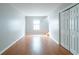 Simple bedroom with hardwood floors and a double door closet at 4480 Joseph Dr, Snellville, GA 30039
