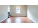 Bright living room with hardwood floors and large window at 4480 Joseph Dr, Snellville, GA 30039