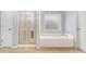 Bathroom with shower and bathtub at 2166 Leatherstone Dr, Powder Springs, GA 30127