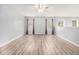 Spacious bonus room with light grey walls and hardwood floors at 2166 Leatherstone Dr, Powder Springs, GA 30127