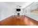 Gathering room with hardwood floors, built-in shelving, and fireplace at 2166 Leatherstone Dr, Powder Springs, GA 30127