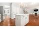 White kitchen island with quartz countertop, offering extra prep space at 2166 Leatherstone Dr, Powder Springs, GA 30127