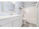 Clean bathroom with white vanity, bathtub, and tile flooring at 2166 Leatherstone Dr, Powder Springs, GA 30127