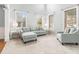 Bright living room with light grey walls, plush seating, and hardwood floors at 2166 Leatherstone Dr, Powder Springs, GA 30127