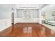Spacious dining room with hardwood floors and wainscoting at 2166 Leatherstone Dr, Powder Springs, GA 30127