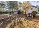 Backyard view showcasing the house and surrounding trees at 3619 Colonial Trl, Douglasville, GA 30135