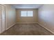 Bright bedroom with neutral walls, carpet flooring, and ample closet space at 3619 Colonial Trl, Douglasville, GA 30135