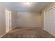 Spacious bedroom featuring neutral walls, carpet flooring, and built-in closet at 3619 Colonial Trl, Douglasville, GA 30135