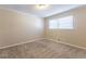 Bright bedroom featuring neutral walls, carpet flooring and a window with blinds at 3619 Colonial Trl, Douglasville, GA 30135
