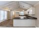 Eat-in kitchen with granite counters, white cabinets, and exposed beams at 3619 Colonial Trl, Douglasville, GA 30135