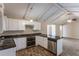 Eat-in kitchen with granite counters, white cabinets, and exposed beams at 3619 Colonial Trl, Douglasville, GA 30135