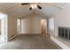 Spacious living room with vaulted ceiling, fireplace, and carpet at 3619 Colonial Trl, Douglasville, GA 30135