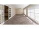Bright living room with French doors and large windows at 3619 Colonial Trl, Douglasville, GA 30135
