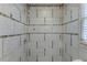 Large tiled shower with neutral tones and modern fixtures at 3619 Colonial Trl, Douglasville, GA 30135
