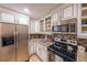 Modern kitchen with stainless steel appliances and granite countertops at 145 15Th Ne St # 401, Atlanta, GA 30309
