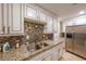 Well-equipped kitchen featuring granite countertops and stainless steel appliances at 145 15Th Ne St # 401, Atlanta, GA 30309