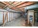 Unfinished basement with exposed utilities and concrete floor at 2715 Connally Sw Dr, Atlanta, GA 30311