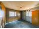 Empty bedroom with wood paneling and hardwood floors at 2715 Connally Sw Dr, Atlanta, GA 30311