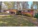Brick ranch house with carport, and a grassy yard at 2715 Connally Sw Dr, Atlanta, GA 30311