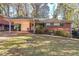 Brick ranch house with carport and mature trees at 2715 Connally Sw Dr, Atlanta, GA 30311