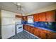 Kitchen with blue countertops and wood cabinets at 2715 Connally Sw Dr, Atlanta, GA 30311