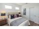 Bright bedroom with a queen bed, hardwood floors, and plenty of natural light at 350 Olmstead Way # 29, Alpharetta, GA 30022