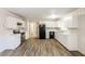 Kitchen with white cabinets, new appliances and wood-look floors at 2273 Hampton Locust Grove Rd, Locust Grove, GA 30248