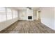 Living room with fireplace, wood-look floors and ceiling fan at 2273 Hampton Locust Grove Rd, Locust Grove, GA 30248