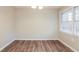 Simple dining area with wood-look floors and neutral walls at 2273 Hampton Locust Grove Rd, Locust Grove, GA 30248