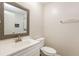 Updated bathroom with a white vanity, decorative mirror, and shower at 2273 Hampton Locust Grove Rd, Locust Grove, GA 30248