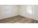 Bright bedroom with neutral walls and wood-look flooring at 2273 Hampton Locust Grove Rd, Locust Grove, GA 30248