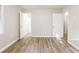Empty bedroom with wood-look vinyl flooring and neutral walls at 2273 Hampton Locust Grove Rd, Locust Grove, GA 30248