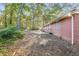 Brick home with a large backyard surrounded by trees at 2273 Hampton Locust Grove Rd, Locust Grove, GA 30248