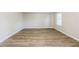 Spacious living room with neutral walls and wood-look flooring at 2273 Hampton Locust Grove Rd, Locust Grove, GA 30248