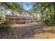 Brick home nestled in a wooded backyard at 2273 Hampton Locust Grove Rd, Locust Grove, GA 30248