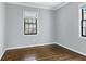 Vacant bedroom featuring hardwood floors and two large windows at 1122 Rosedale Ne Dr # B4, Atlanta, GA 30306