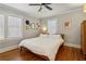 Spacious main bedroom with hardwood floors, ceiling fan, and ample natural light at 2 Collier Nw Rd # 5, Atlanta, GA 30309